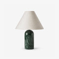 Clérachic lamp in a dark green marble finish, shown unlit and upright against a plain white backdrop.