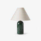 Clérachic lamp in a dark green marble finish, shown unlit and upright against a plain white backdrop.