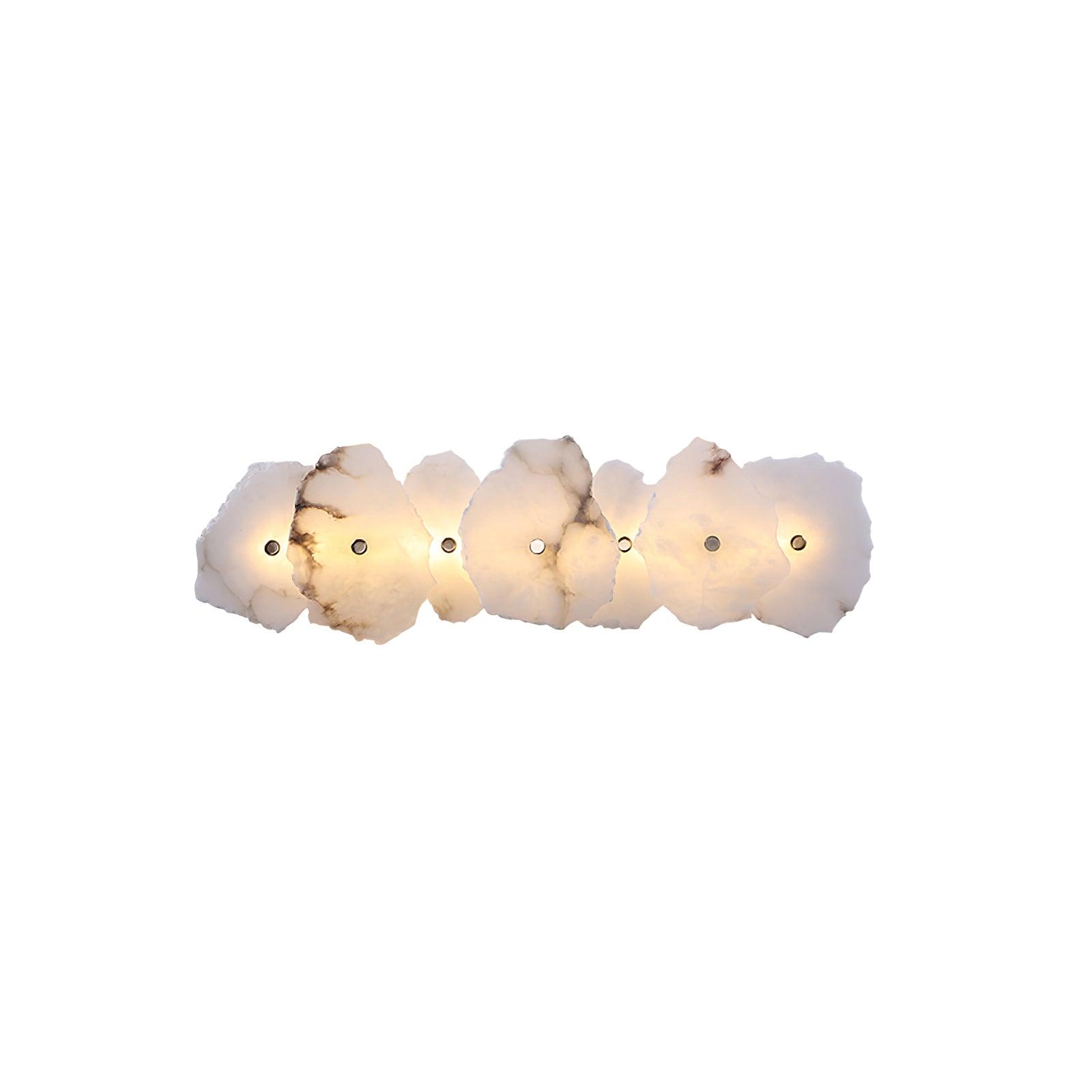 Seven-head alabaster wall lamp laid out horizontally, veined stone slabs overlapping like petals.