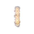 Seven-head alabaster wall lamp stacked into a tall column, front view on a plain white backdrop.