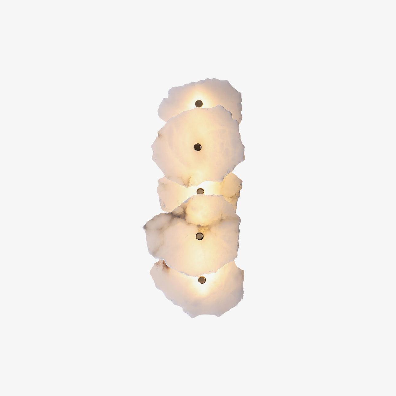 Vertical five-head alabaster wall lamp centred on white, the whole fixture shown lit end to end.