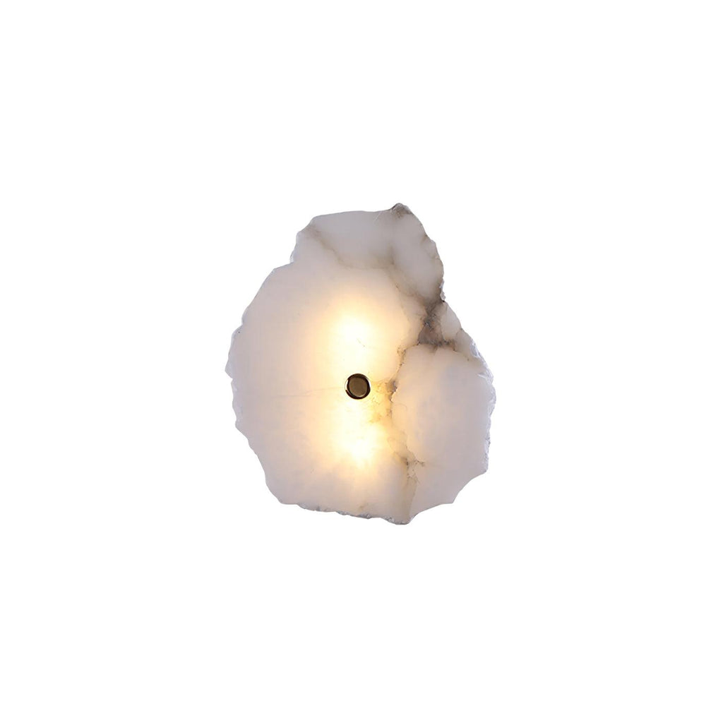 Single-head alabaster wall lamp lit from within, one brass stud centred on the raw-edged stone petal.