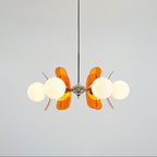 Sputnik chandelier with warm glass shades on each arm