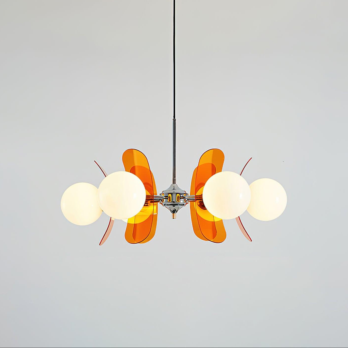 Sputnik chandelier with warm glass shades on each arm