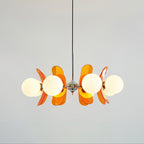 Sputnik chandelier glowing with warm light in interior