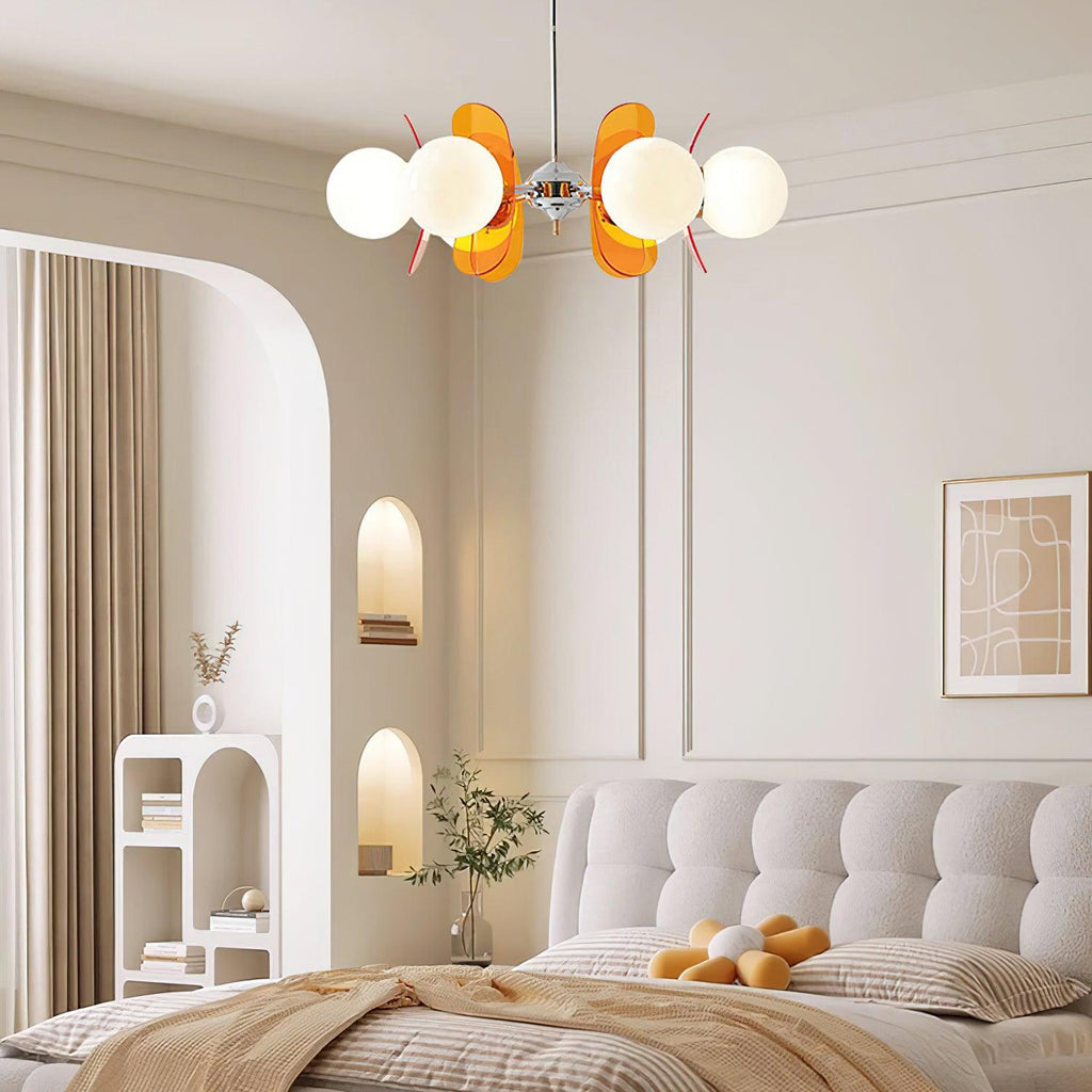 Multi-arm Sputnik chandelier glowing above a table
