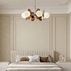 Iron Sputnik chandelier with warm glass shades detail