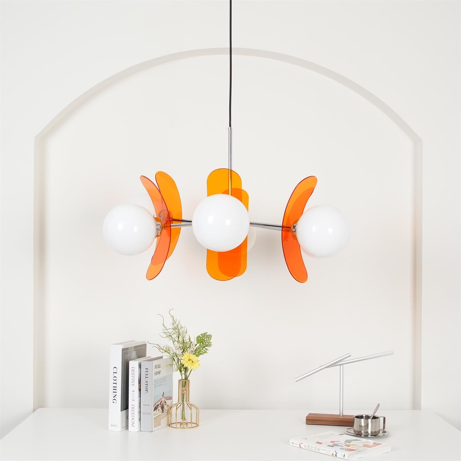 Multi-arm chandelier with soft glass shades and metallic sheen