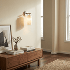 Translucent alabaster wall light with gold arm and warm light