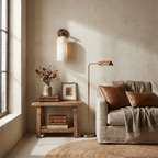 Minimal alabaster pillar sconce glowing softly in a styled room