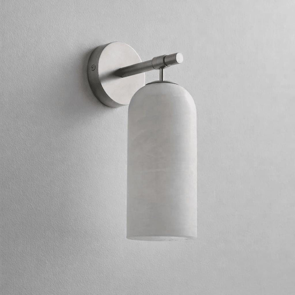 White alabaster pillar wall light with a slim gold metal arm