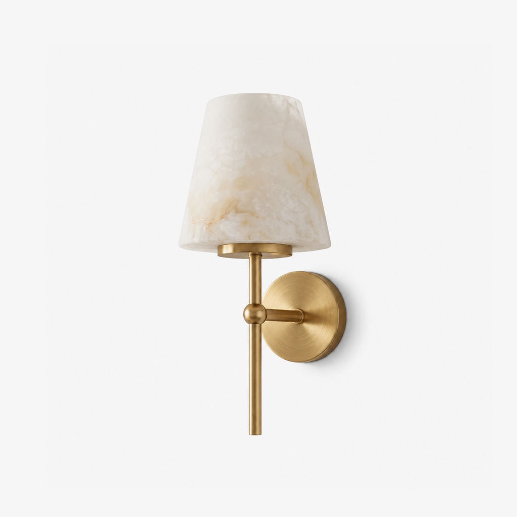 Shown alone against a plain backdrop, the tapered alabaster shade of this Clérachic wall light sits in brushed brass.
