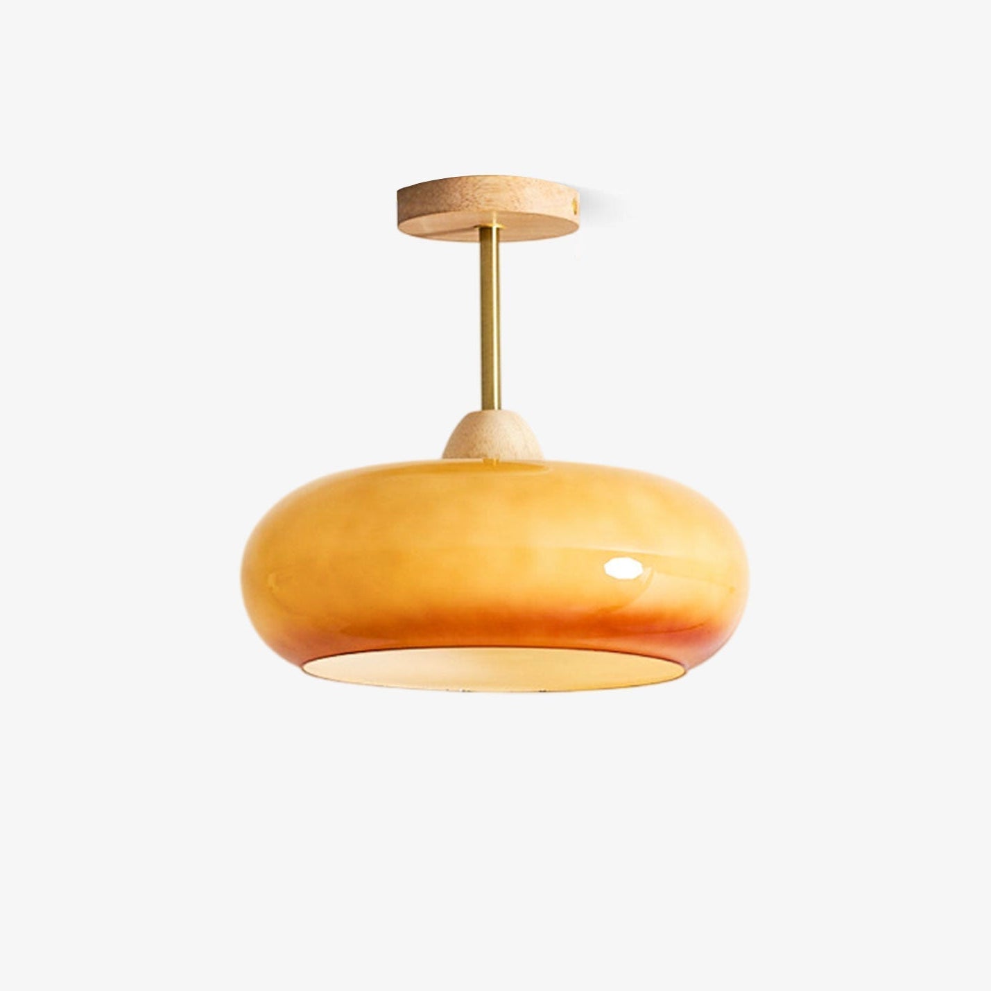 Plafonnier ceiling light glass disc seen from below with warm glow