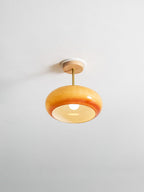 Plafonnier ceiling light in orange finish mounted on the ceiling