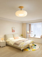 Plafonnier ceiling light shown installed against a textured ceiling