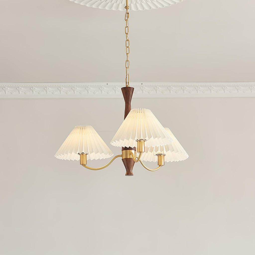 Looking up at the three-head version of this Clérachic chandelier, its pleated shades clustered close beneath the ceiling.