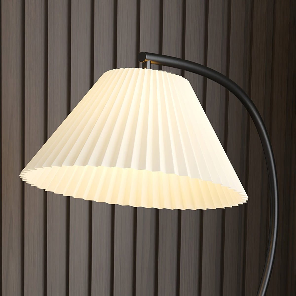 A close crop against a wood-slat wall shows the pleats of this Clérachic lamp's fabric shade in detail.