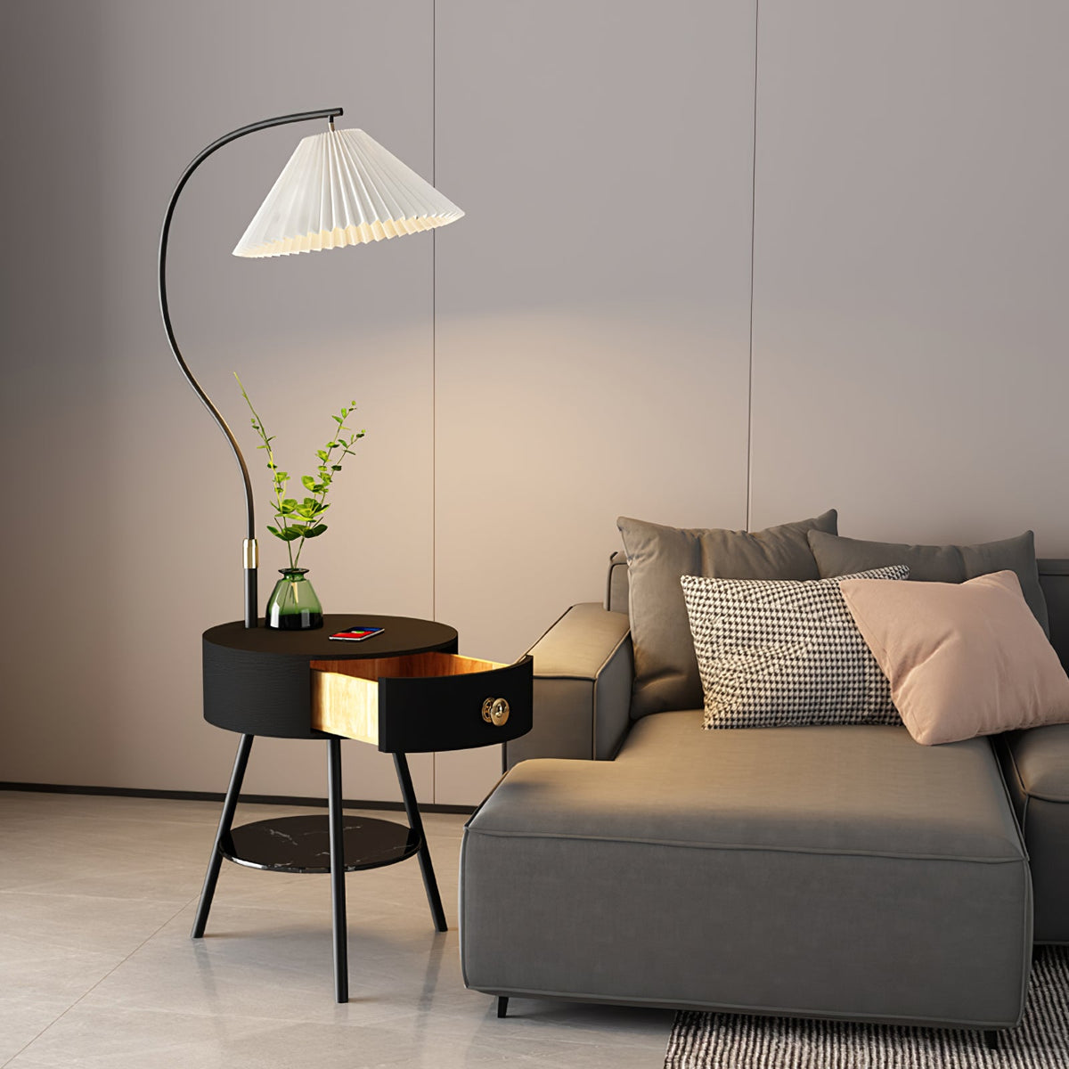 The black-finish Clérachic lamp stands beside the grey sofa, its drawer open to show the wood-lined interior.