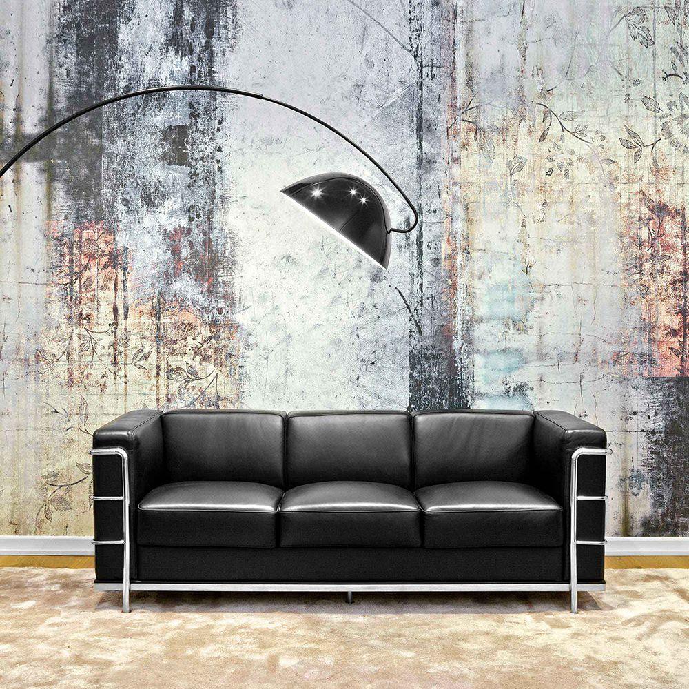 Verse arc floor lamp arcing gracefully beside furniture