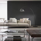 Verse arc floor lamp standing tall in a high-ceiling room