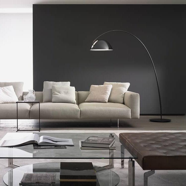 Verse arc floor lamp standing tall in a high-ceiling room