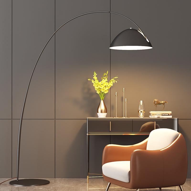 Verse arc floor lamp beside a console in a modern setting