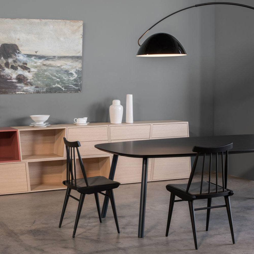 Verse arc floor lamp full silhouette in a bright room