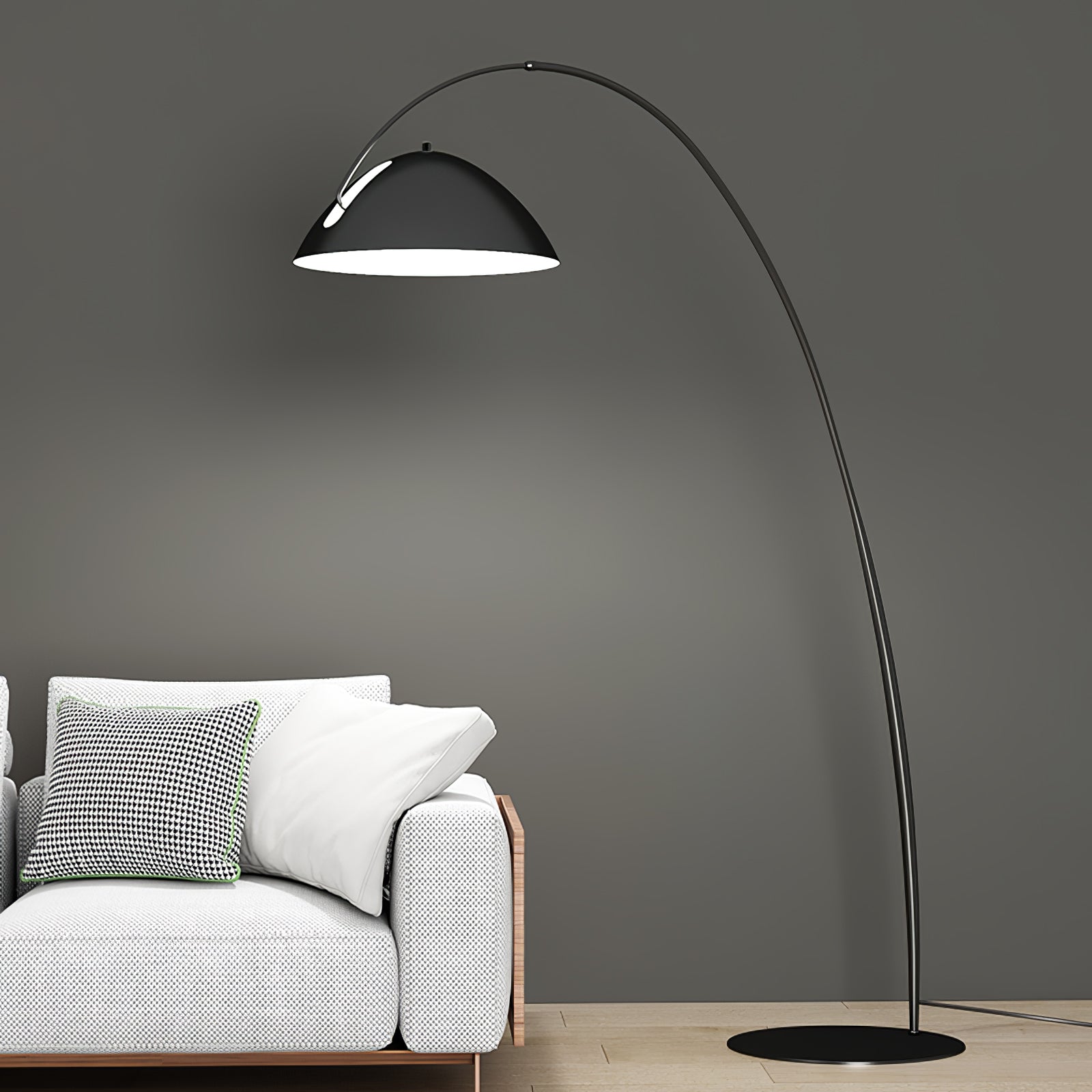 Verse arc floor lamp arcing over a sofa with warm light