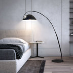Verse arc floor lamp standing beside a window