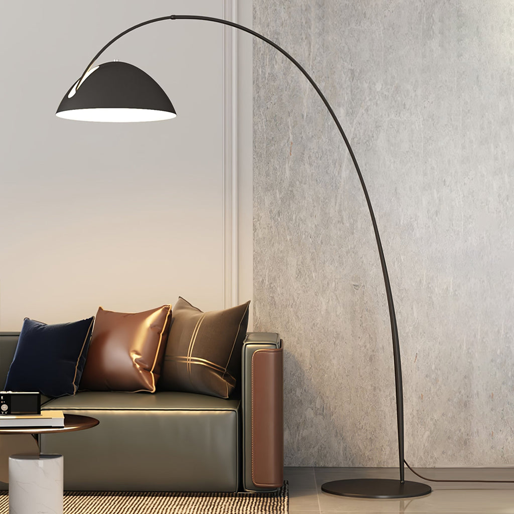 Verse arc floor lamp arcing over a seating area with warm glow