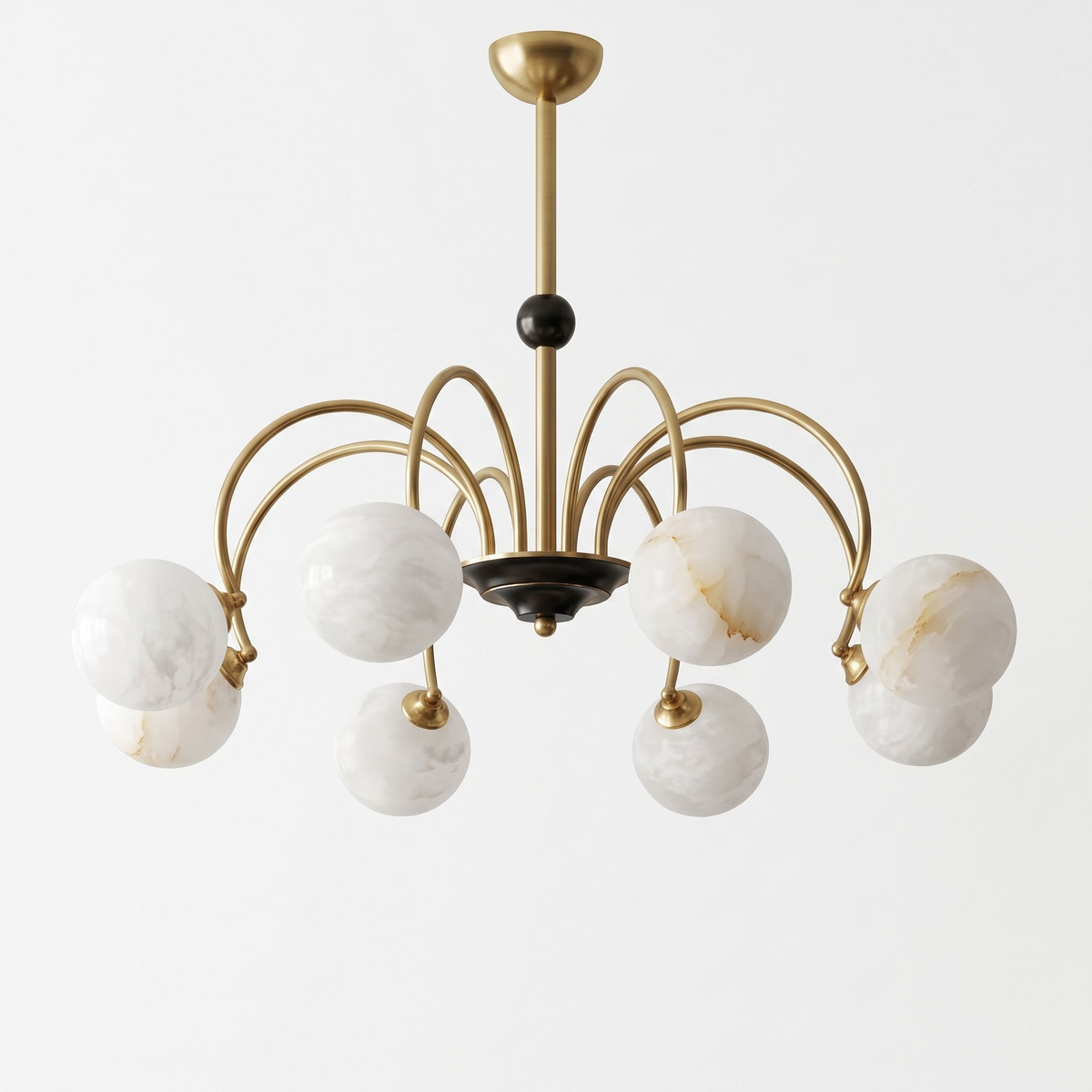 This brass Clérachic chandelier stands unlit on a plain white background, a small black accent marking where its arms meet.