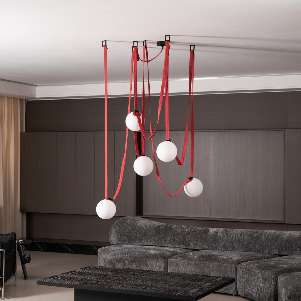 Belt pendant light angled view over an interior