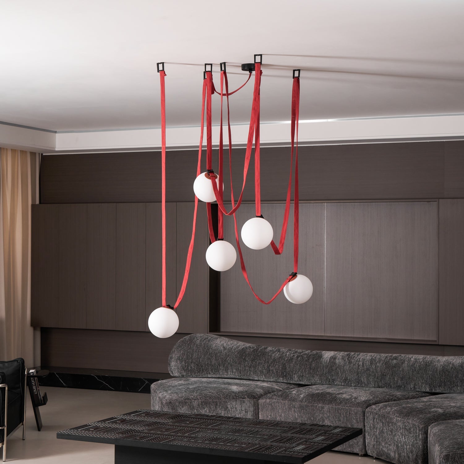 Belt pendant light angled view over an interior