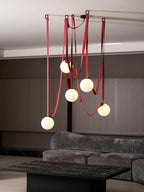 Belt pendant light glass globes and iron frame detail