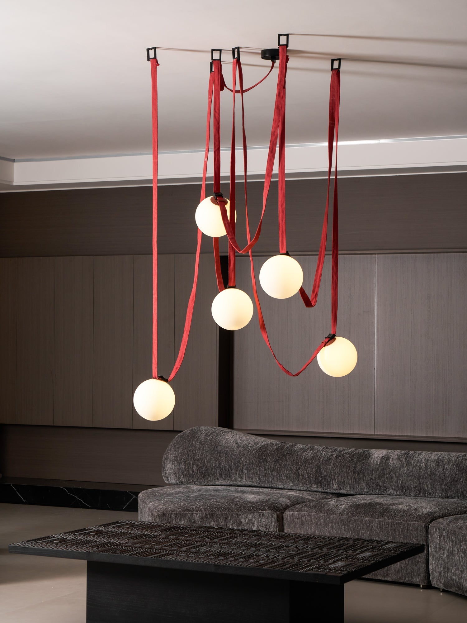 Belt pendant light glass globes and iron frame detail