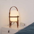 Portable wood and glass lantern lamp with warm light