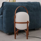 Portable wood lantern lamp glowing on the floor