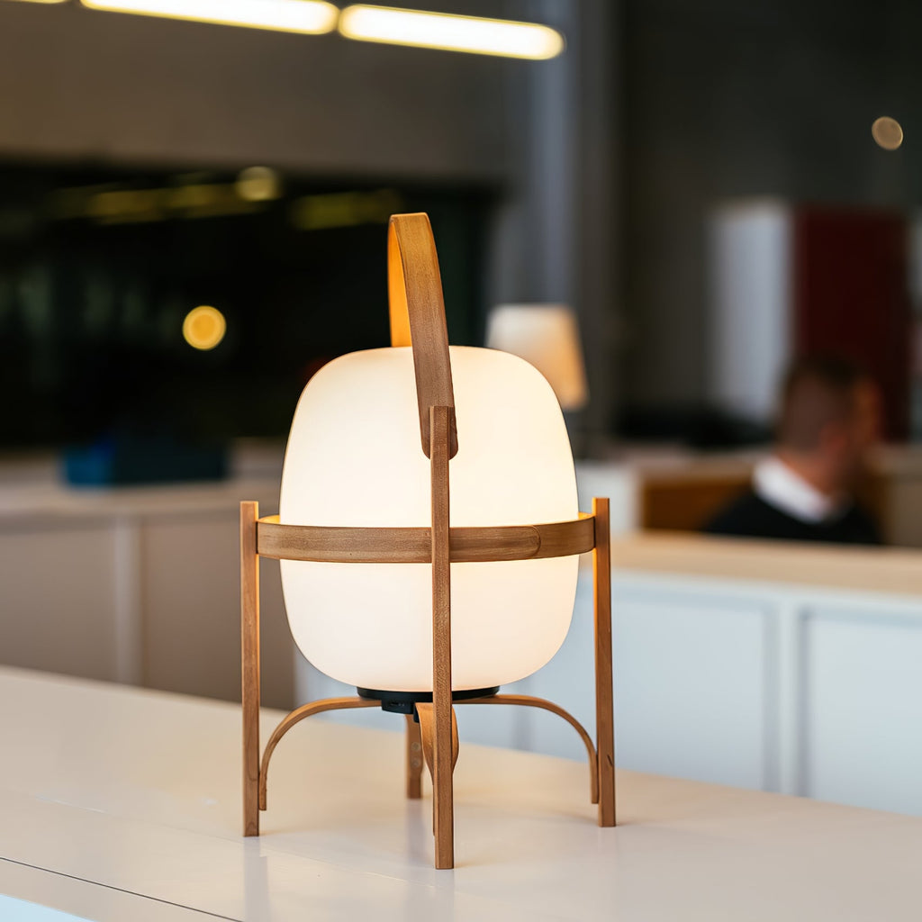 Wood and glass lantern lamp casting a warm glow
