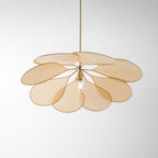 Studio shot of this Clérachic pendant lamp, its beige petals fanned into a wide dome around a bare bulb.