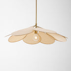Studio shot of this Clérachic pendant lamp, its beige petals fanned compactly around a glowing bulb.