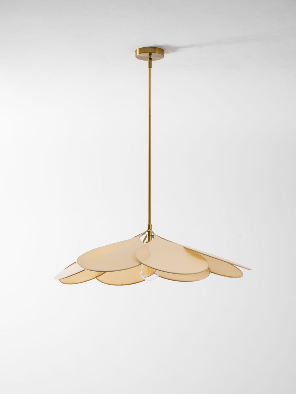 Studio shot of this Clérachic pendant lamp, its beige petals compact and layered beneath a long brass stem.