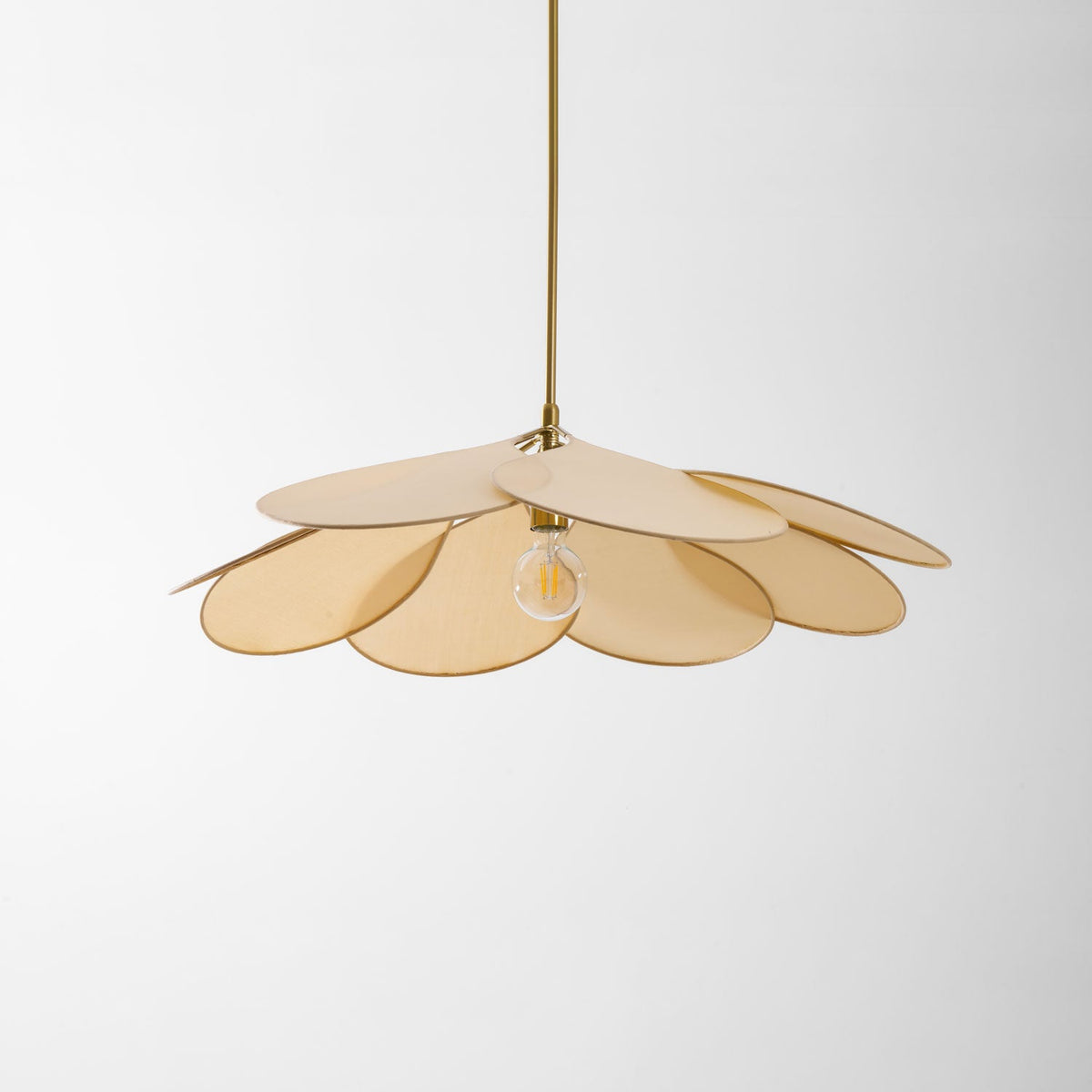 Studio shot of this Clérachic pendant lamp seen from above, its beige petals overlapping around a dim bulb.