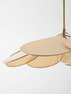 Close view of this Clérachic pendant lamp's beige petals seen from above, with its bulb just visible at the edge.