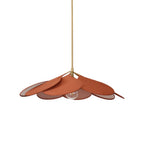This Clérachic pendant lamp in terracotta petals hangs from a brass stem against a plain white background, its bulb visible beneath.