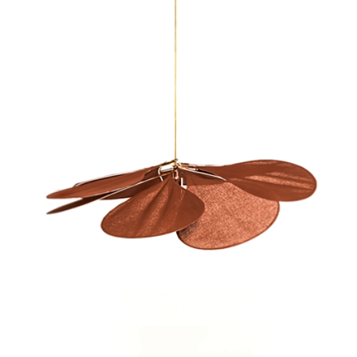 Studio shot of this Clérachic pendant lamp viewed from the side, its rust-brown petals fanned unevenly on a brass stem.