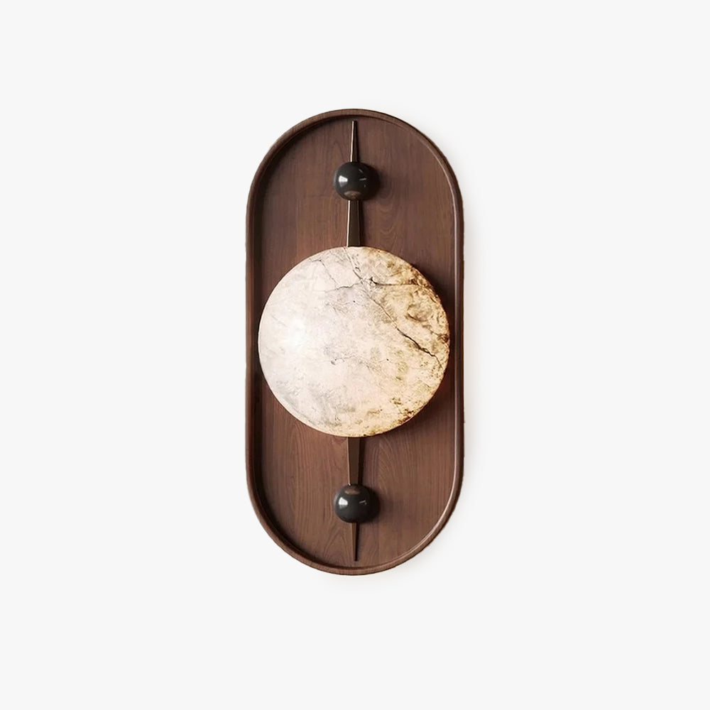 The walnut and alabaster wall light on white, seen straight on with its black ball fixings.