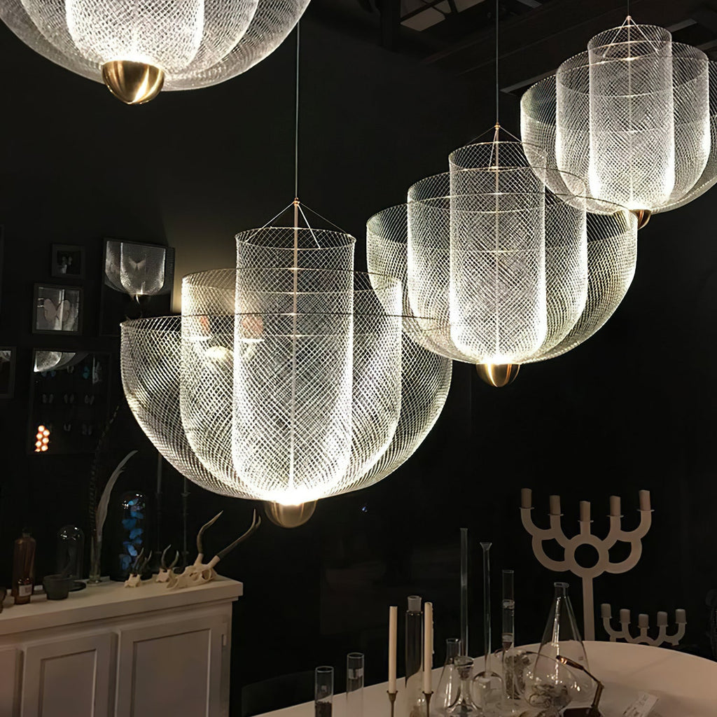Wirework pendant light suspended over a table setting