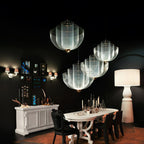 Spherical steel wire pendant light against a plain wall