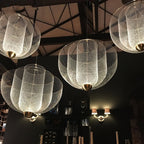 Layered wire pendant light detail of the upward facing glow