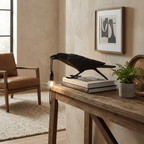 Black raven lamp detail showing sculpted feathers and bulb